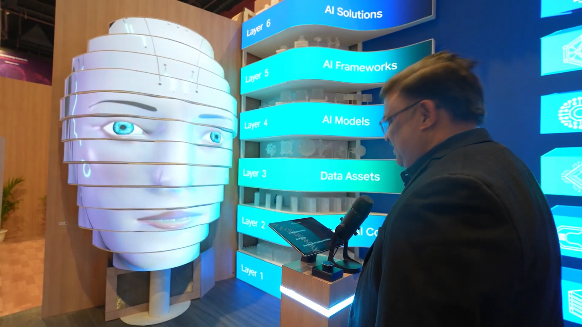 AI installation with digital face and AI stack display